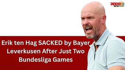 Erik ten Hag looking dejected on the sidelines during a Bayer Leverkusen vs. Werder Bremen Bundesliga match with intense football atmosphere